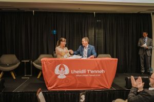 Lheidli T'enneh Chief Dolleen Logan and Prince George Chamber of Commerce President Ray Noonan shake hands