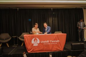 Lheidli T'enneh Chief Dolleen Logan and Prince George Chamber of Commerce President Ray Noonan sign the partnership agreement.