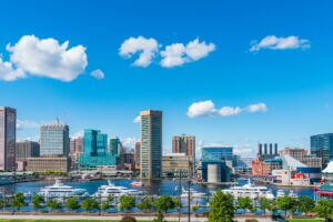 Skyline of the Inner Harbor of Baltimore, Maryland on a sunny summer day.