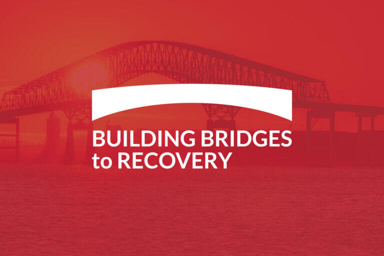 Red opaque graphic with Key Bridge at sunset in background with the Building Bridges to Recovery campaign logo in white above.