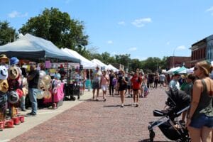 291A2168 residents walk vendor booths at Sweet Corn Festival