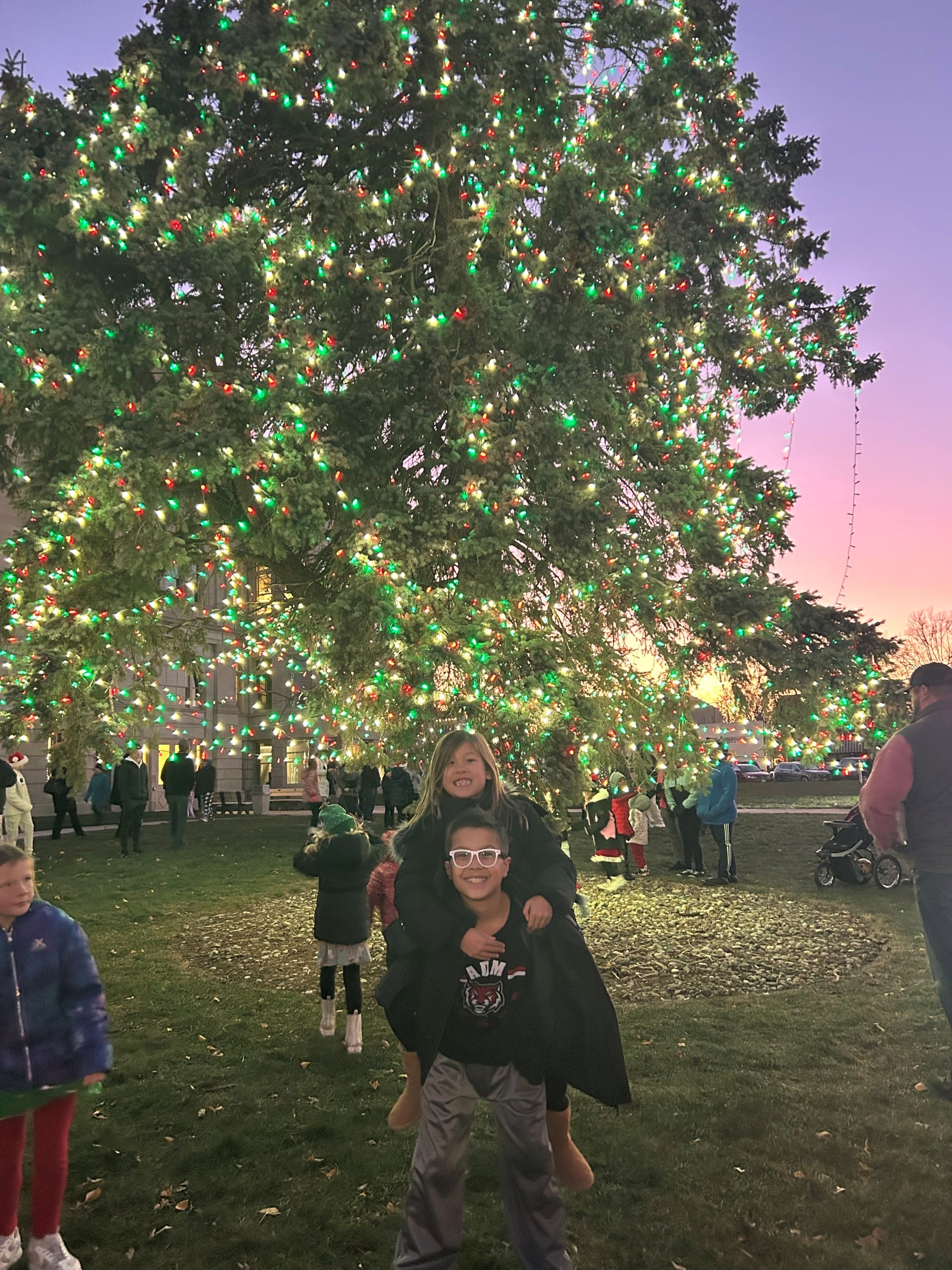 kids at the lighted tree