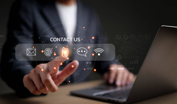 istockphoto-1450058572-612x612 Businessman using a laptop and touching on virtual screen contact icons consists of telephone, email, address, live chat, internet wifi, Contact us or Customer care support hotline people connect.