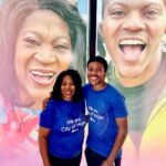 Shaunese and Destin in front of promo window