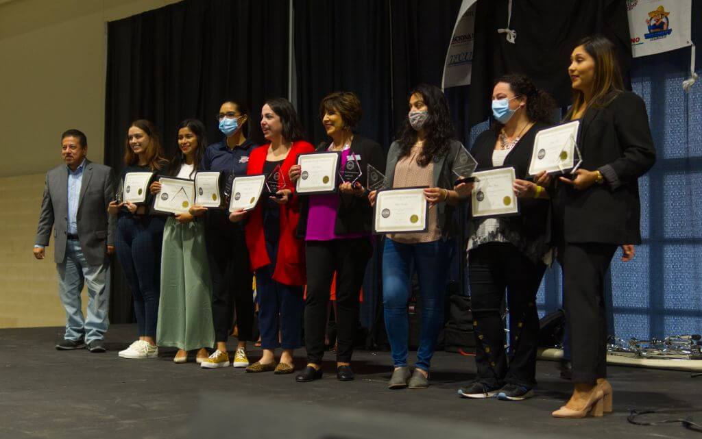 women receiving certificates and awards