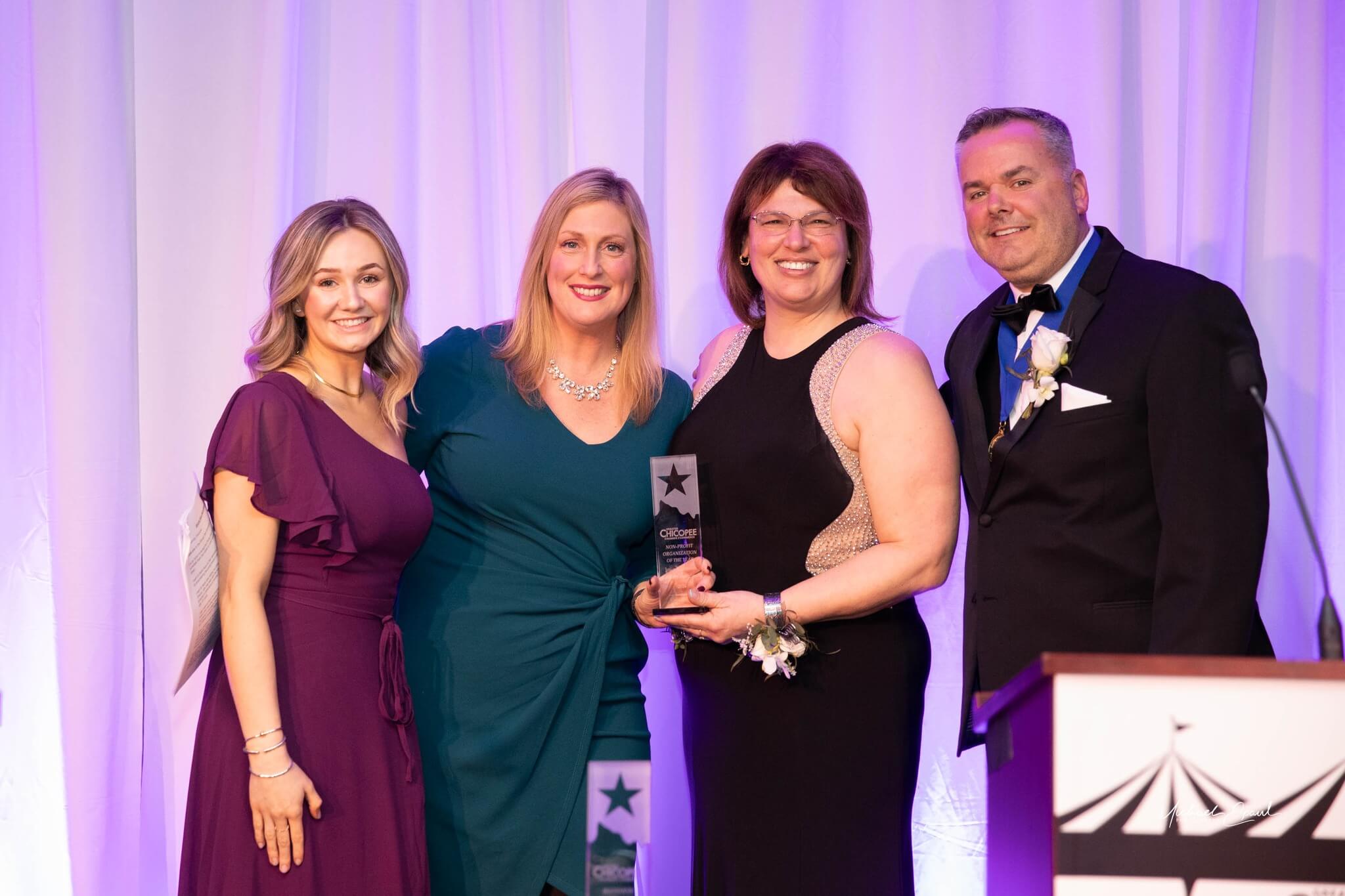 Junior Achievement of Western Massachusetts, accepting the Nonprofit of the Year award, with Emcees Jeremy Procon and Haley Procon.