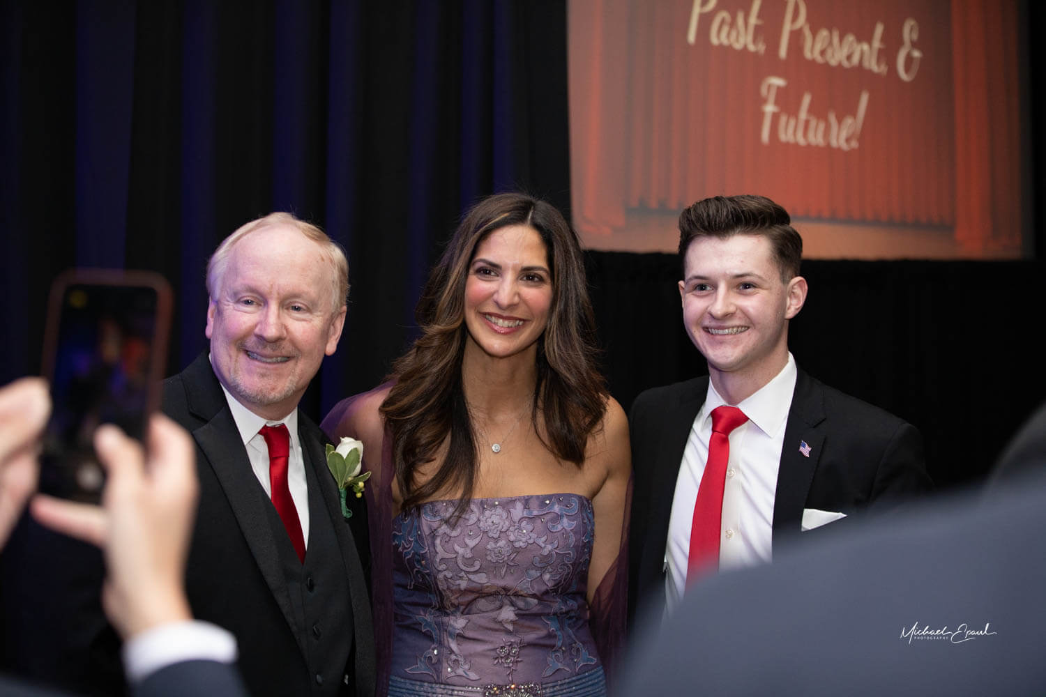 Masters of Ceremony Mike Knapik and Michelle Wirth with Samuel Shumsky.