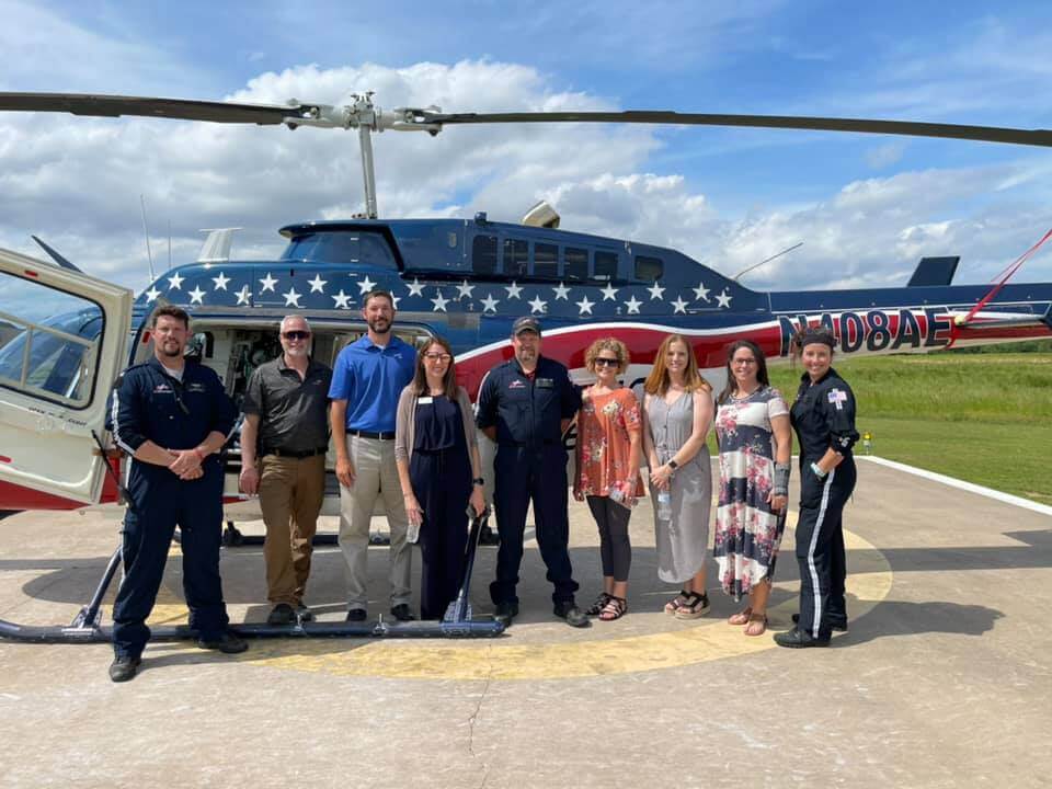 people in front of helicopter