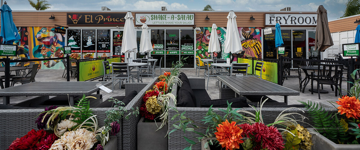 flowers and seating outside of restaurants