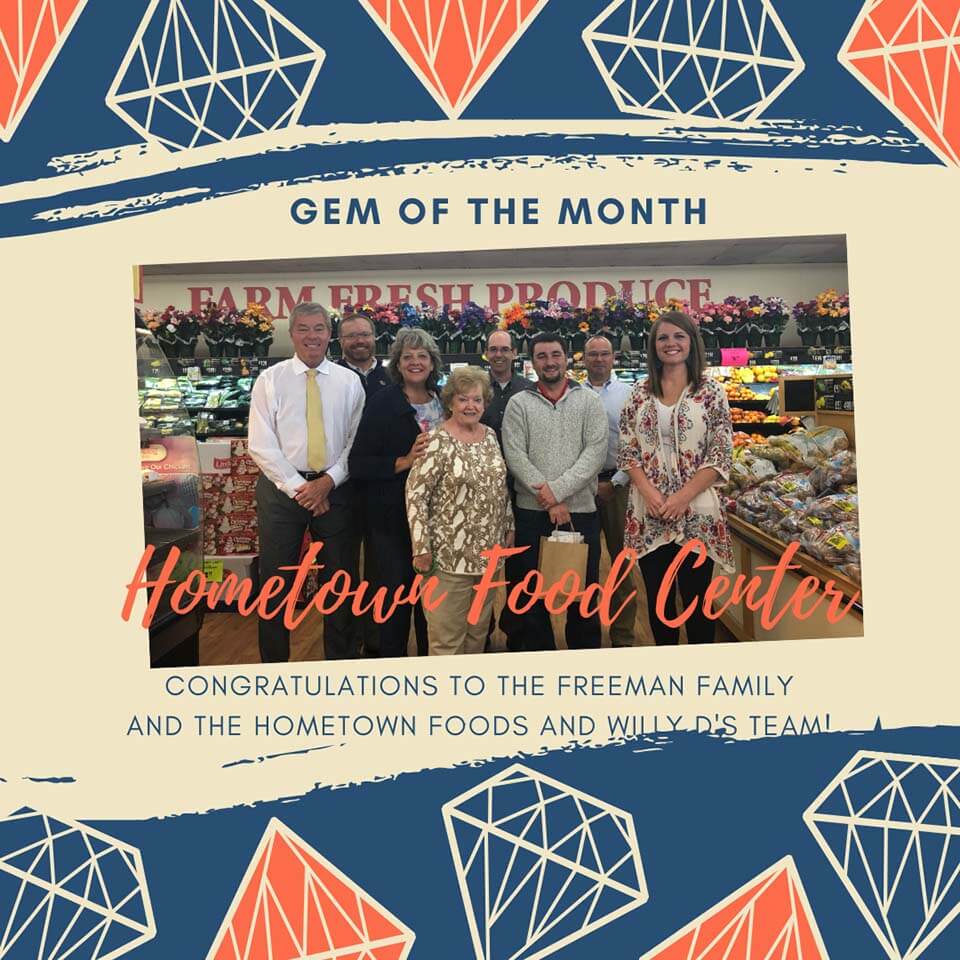 Hometown Food Center gem of the month graphic, people posing