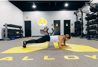 Woman exercising at Alloy Personal Training
