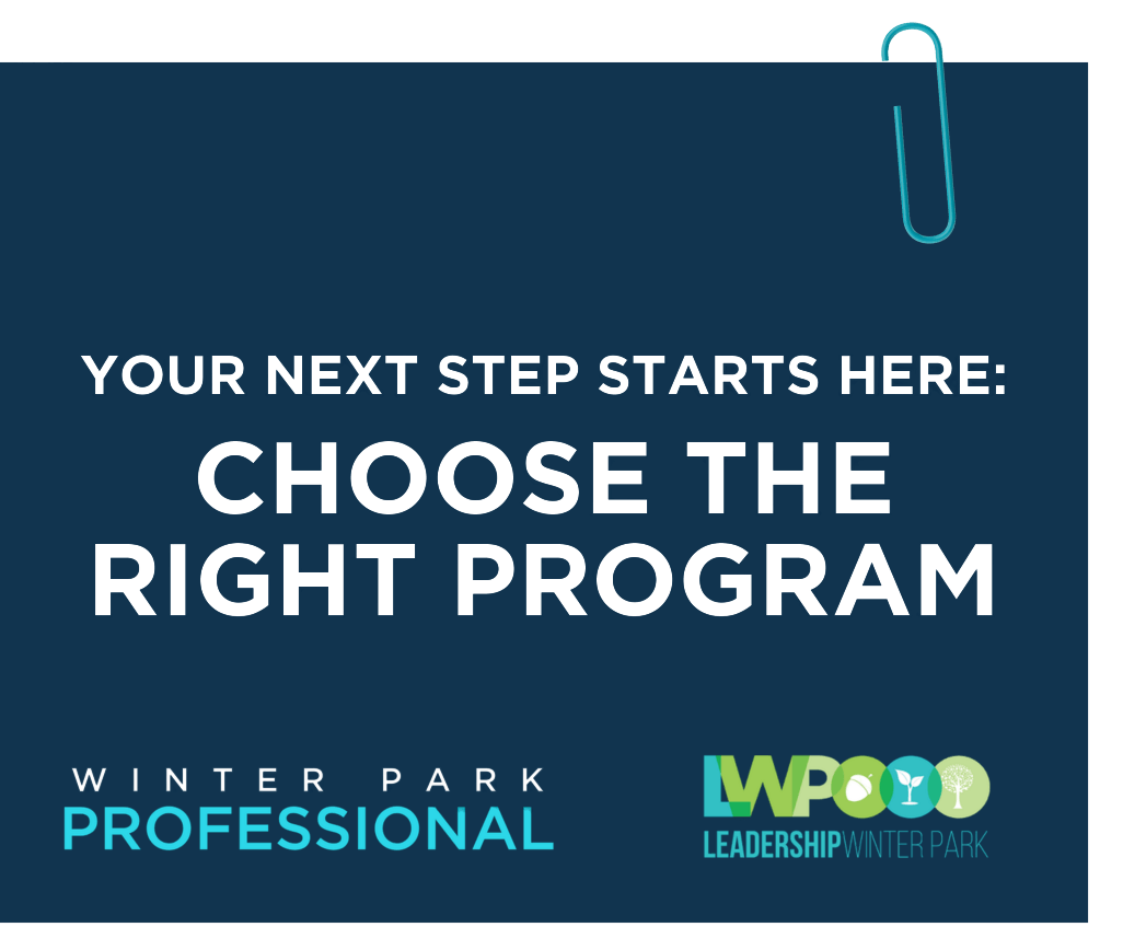 A paper clip holds a sheet of paper inviting users to learn more about Leadership Winter Park vs. Winter Park Professional