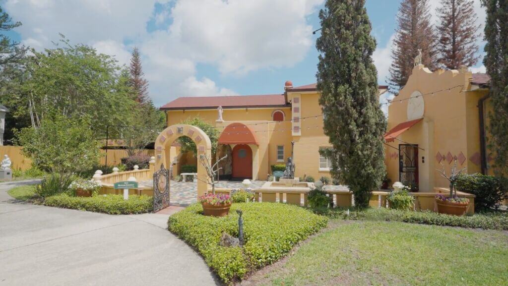 Albin Polasek's yellow home with red roof and large rounded front door