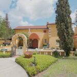 Albin Polasek's yellow home with red roof and large rounded front door