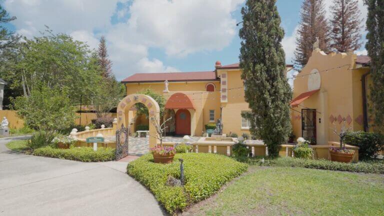 Albin Polasek's yellow home with red roof and large rounded front door