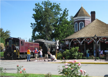 historic depot exterior with train on tracks
