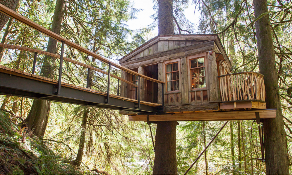 beautiful custom built tree house in the woods