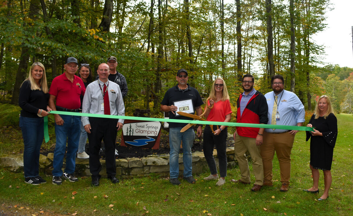 The Garrett County Chamber of Commerce, in partnership with the Garrett County Department of Business Development, held a ribbon cutting ceremony on Wednesday, September 17, 2025, to celebrate the opening of Sweet Springs Glamping in Oakland, Maryland.