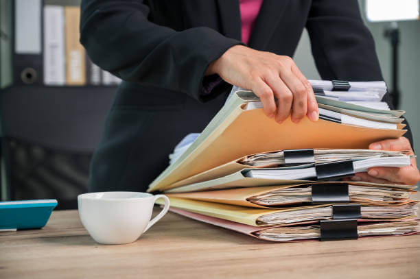 istockphoto-1341818358-612x612 Close up Office employee working with documents at business desk in a business office
