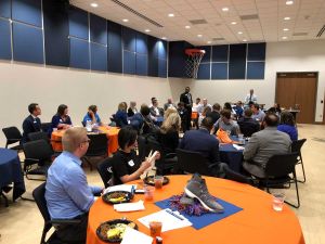 people listening to a speaker