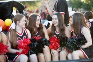 varsity cheerleaders at homecoming parade 2022 - 4