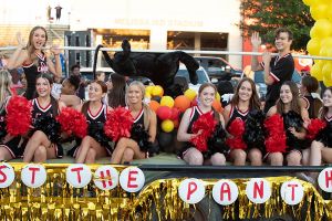 varsity cheerleaders at homecoming parade 2022 - 4