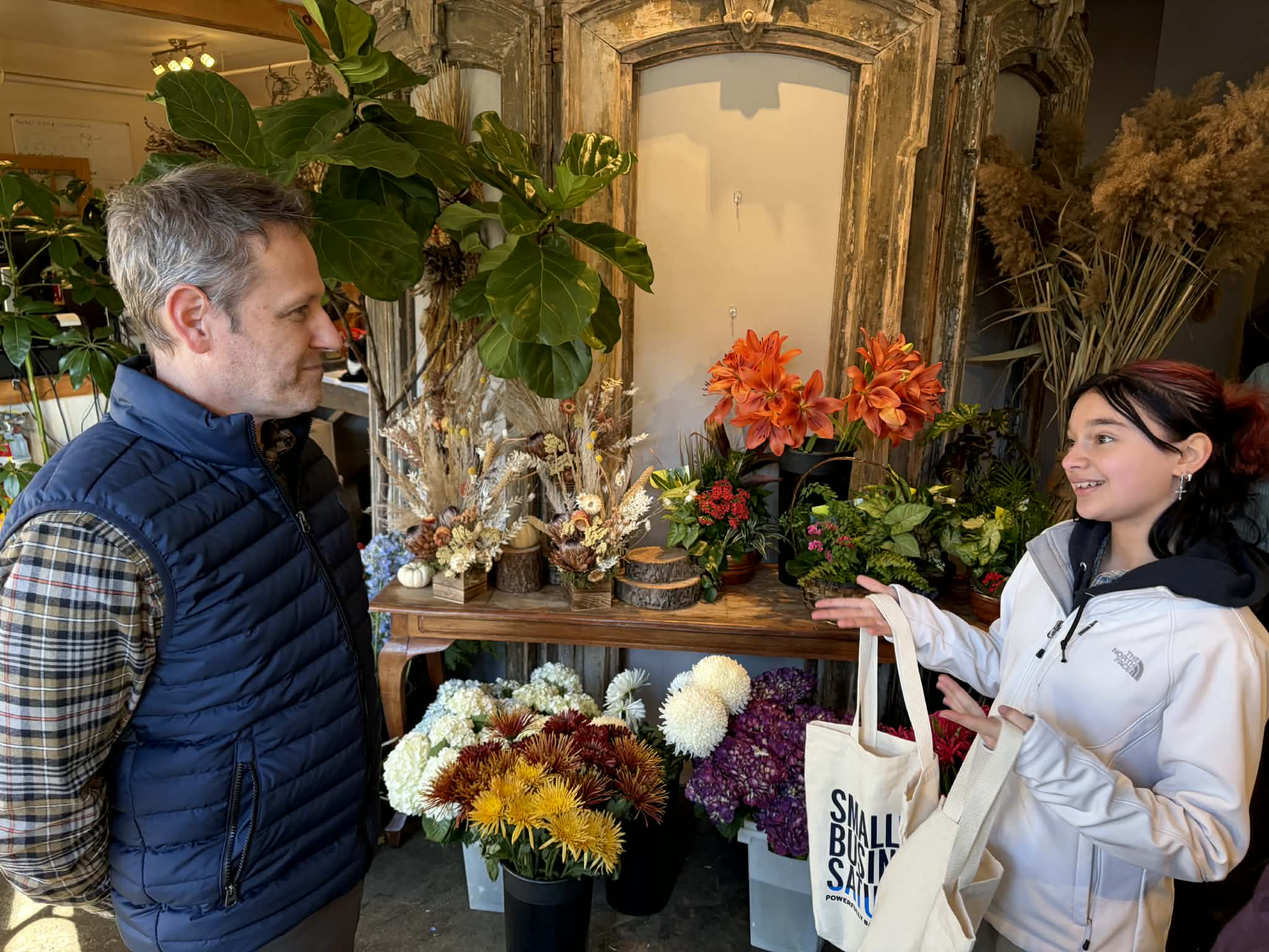 HFM PTEXH student talking with worker at Studio Herbage Florist & Flower Delivery