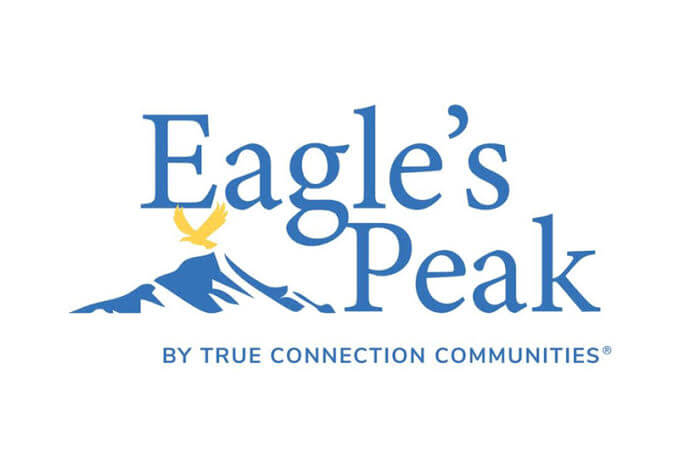 Eagle's Peak by True Connection Community with mountain outline and eagle flying over
