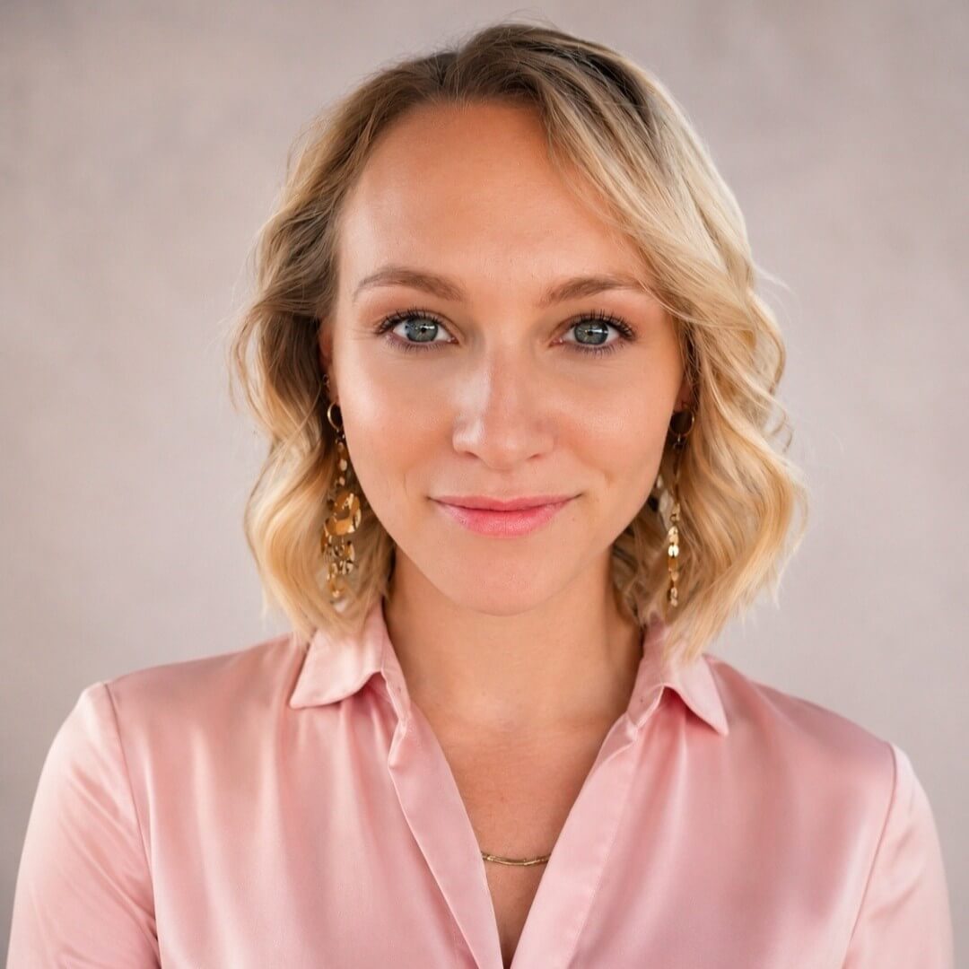 Breeanna Wakefield smiling in a pink collared blouse