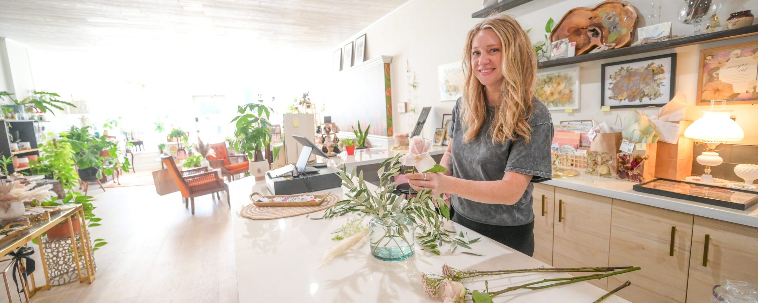 Local business owner arranging flowers