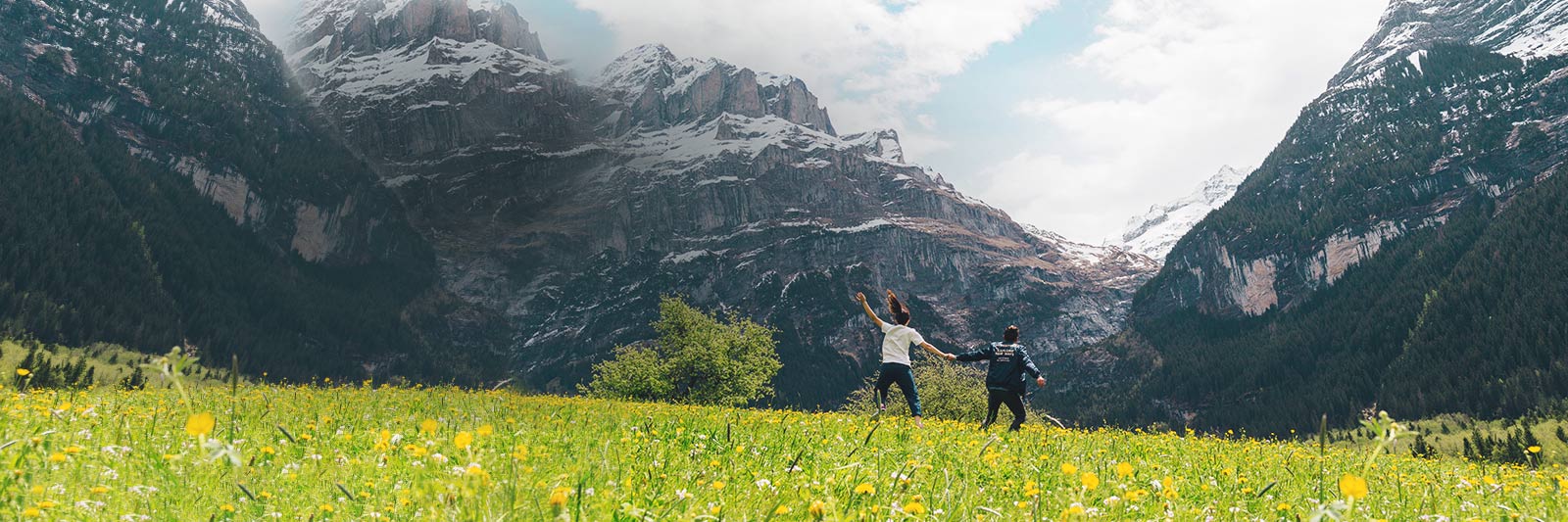 People Running Toward Mountains