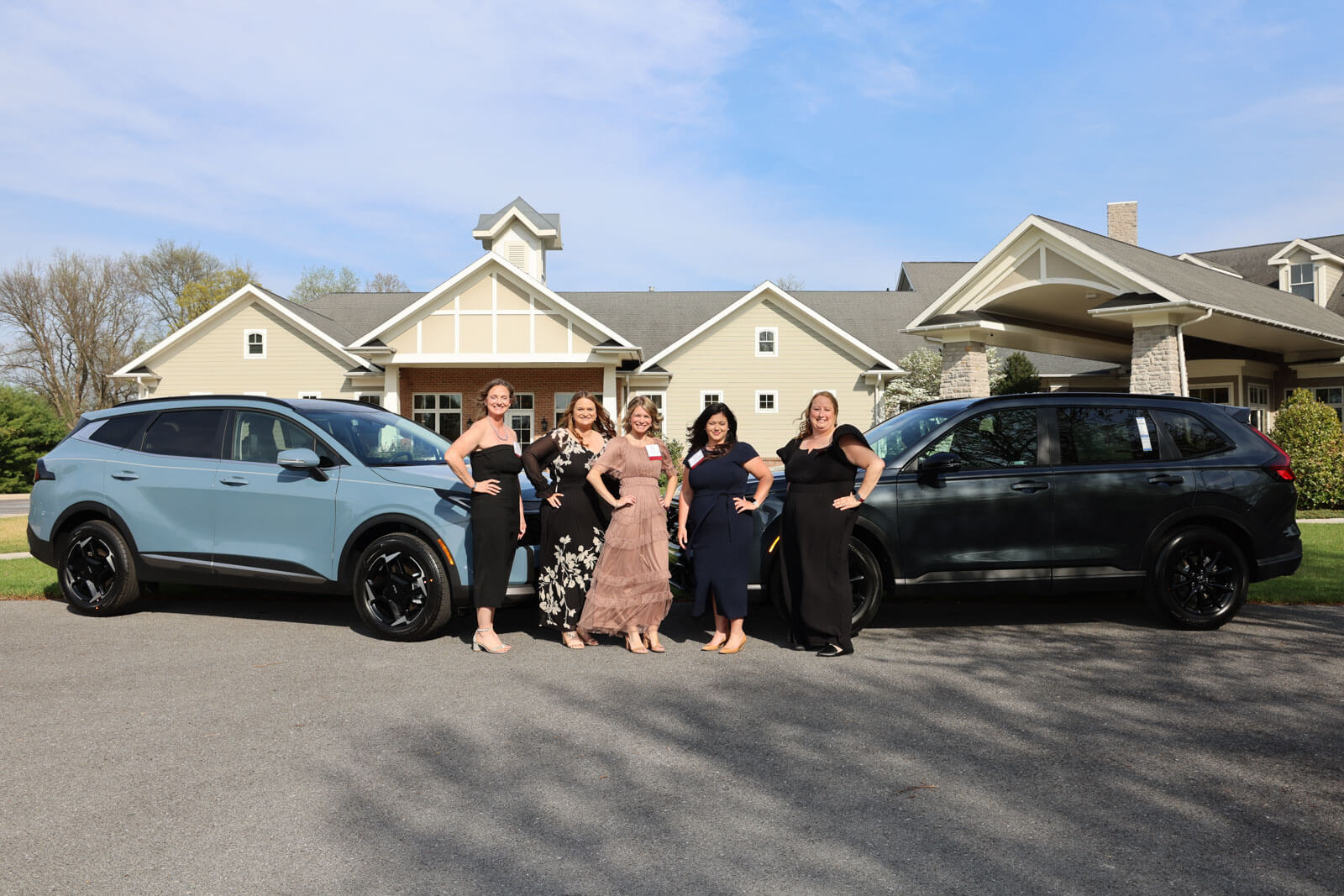 Teacher of the Year finalists pose with cars donated by Hagerstown Honda.