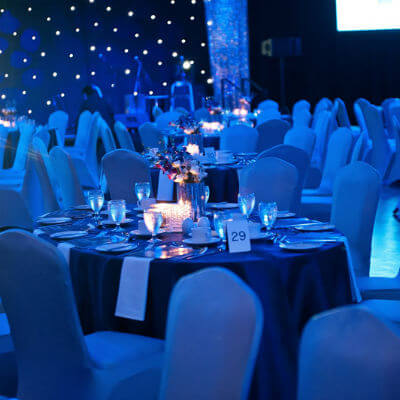 event tables in blue lighting