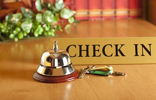Hotel check in sign with bell