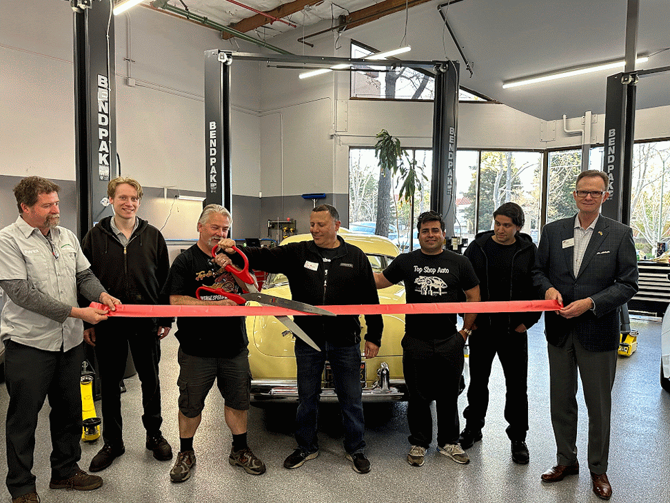 Group celebrating Top Shop Auto Ribbon Cutting