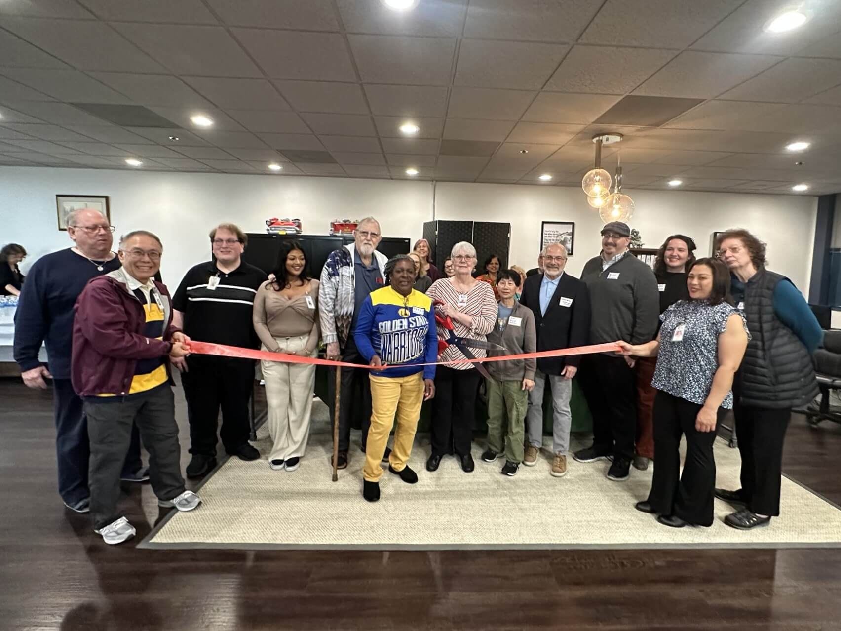 Group gathered for the ribbon cutting ceremony at Mobility Matters