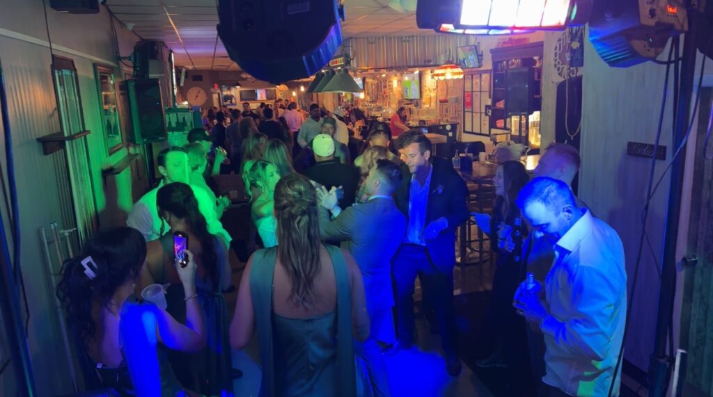 People having a fun time dancing to the DJ at Our Place on 3rd.