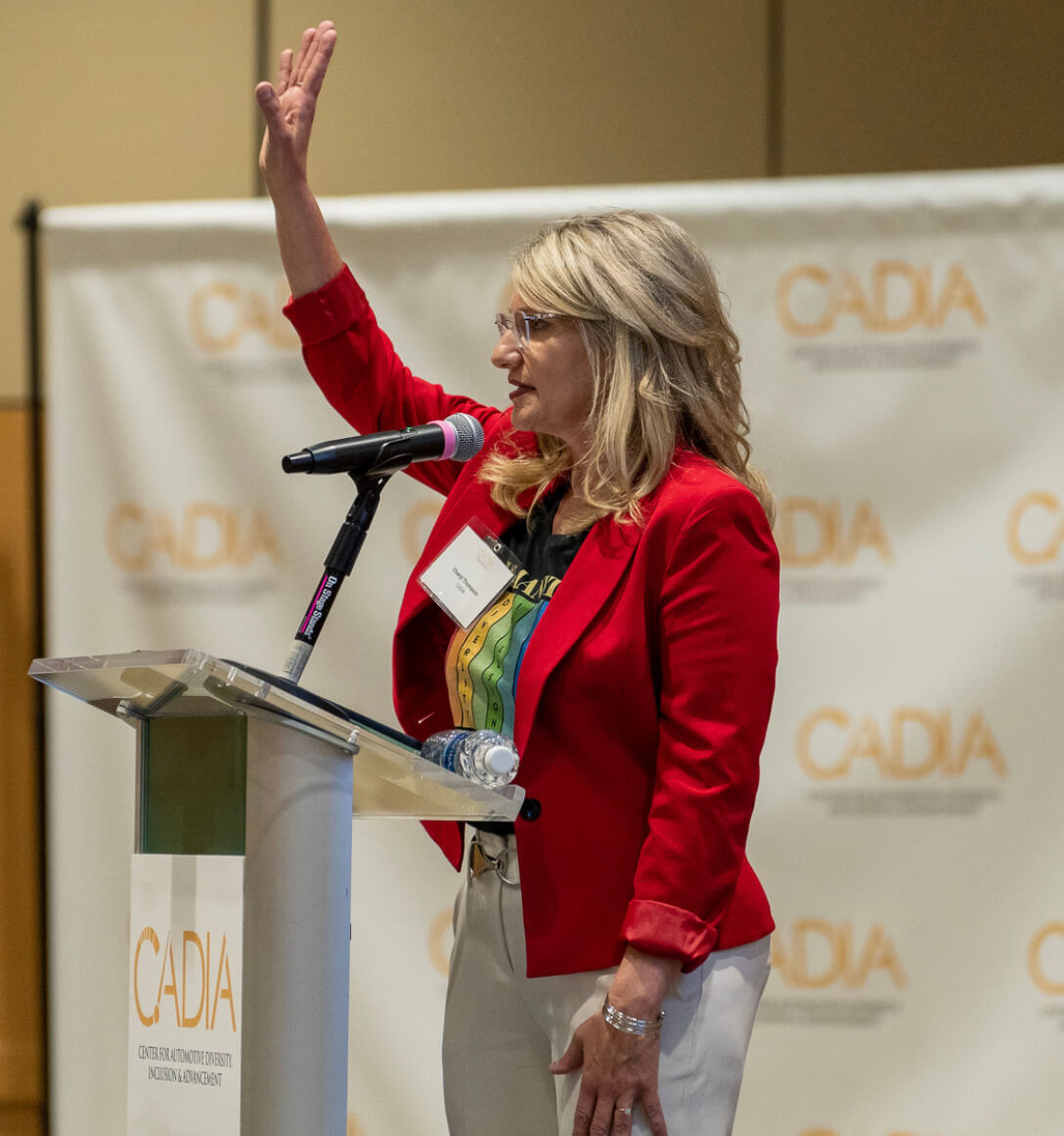 photo of cheryl thompson speaking at a podiium