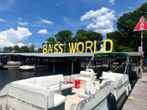 Bass World Lodge Sign with Boat Beside Dock_Brandy Jo Hastings_