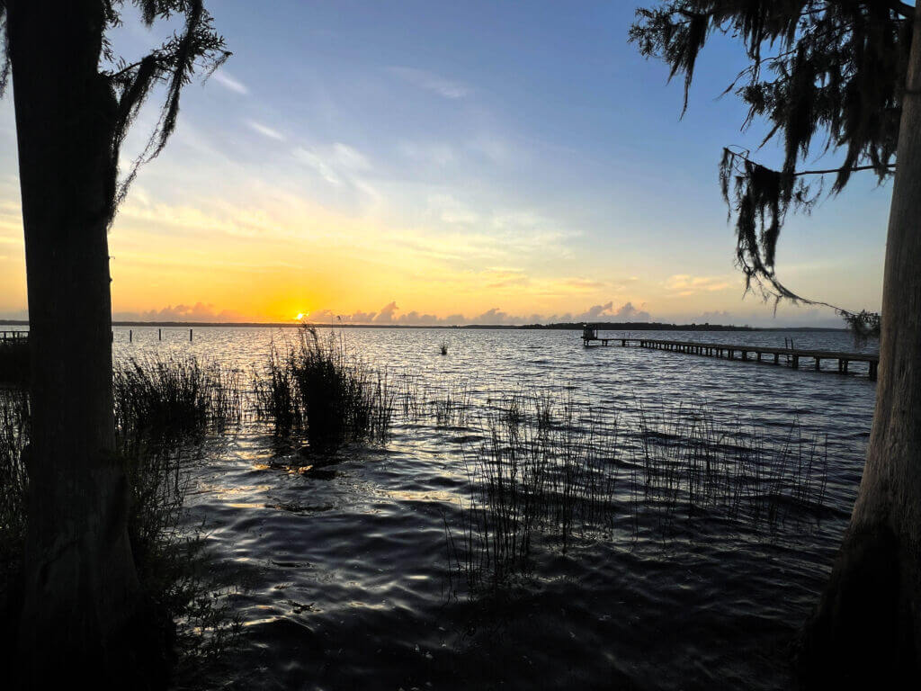 Sunrise over water with dock at Crescent Fish Camp_Brandy Jo Hastings_