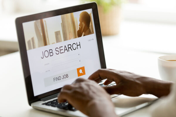 Photo of a laptop open to a job search page displaying San Leandro job opportunities.