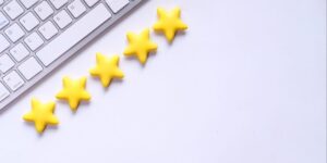 A computer keyboard with five gold stars underneath
