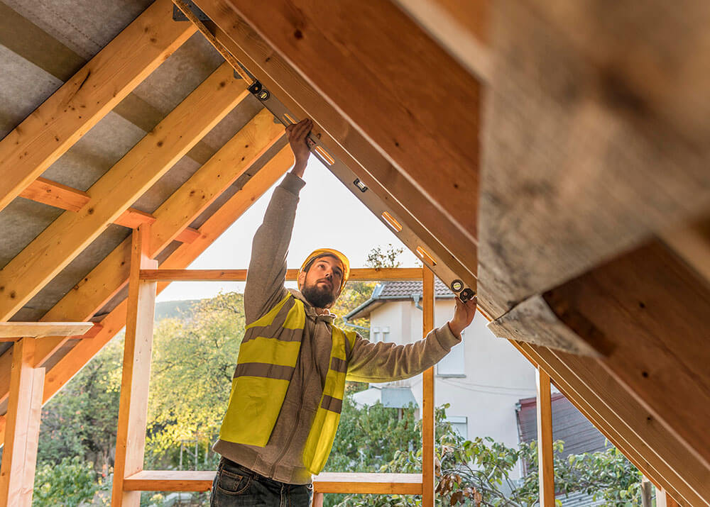 carpenter working on roof