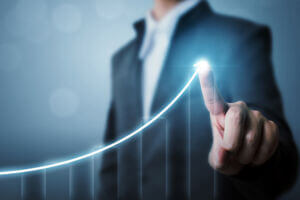 Business development to success and growing growth concept, Businessman pointing arrow graph increase chart