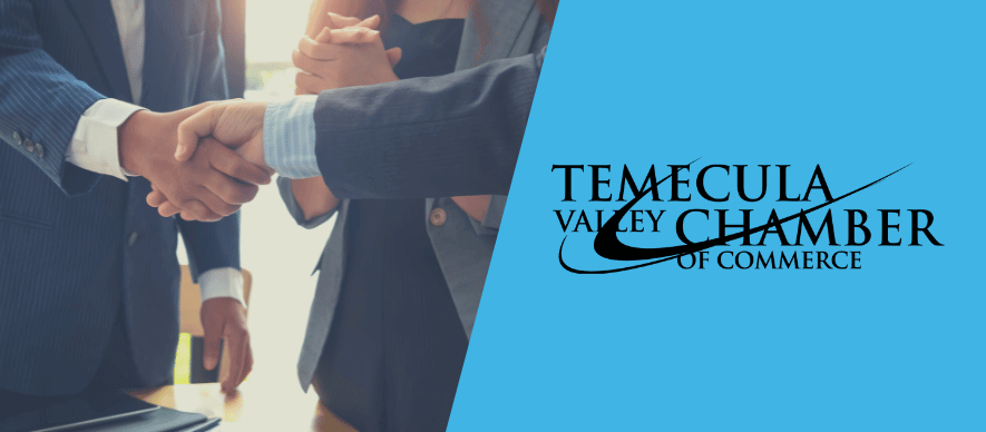 People shaking hands next to the Temecula Chamber logo