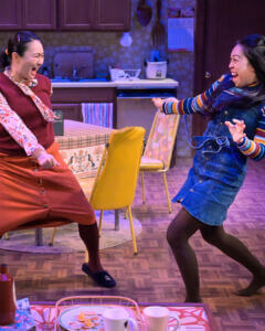 Two asian women dancing. Production photo from The Hearts Sellers at Aurora Theatre Company