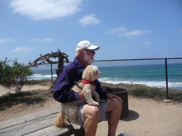 Bob Miller with his dog at the beach
