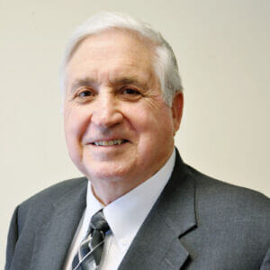 smiling caucasian male with white hair