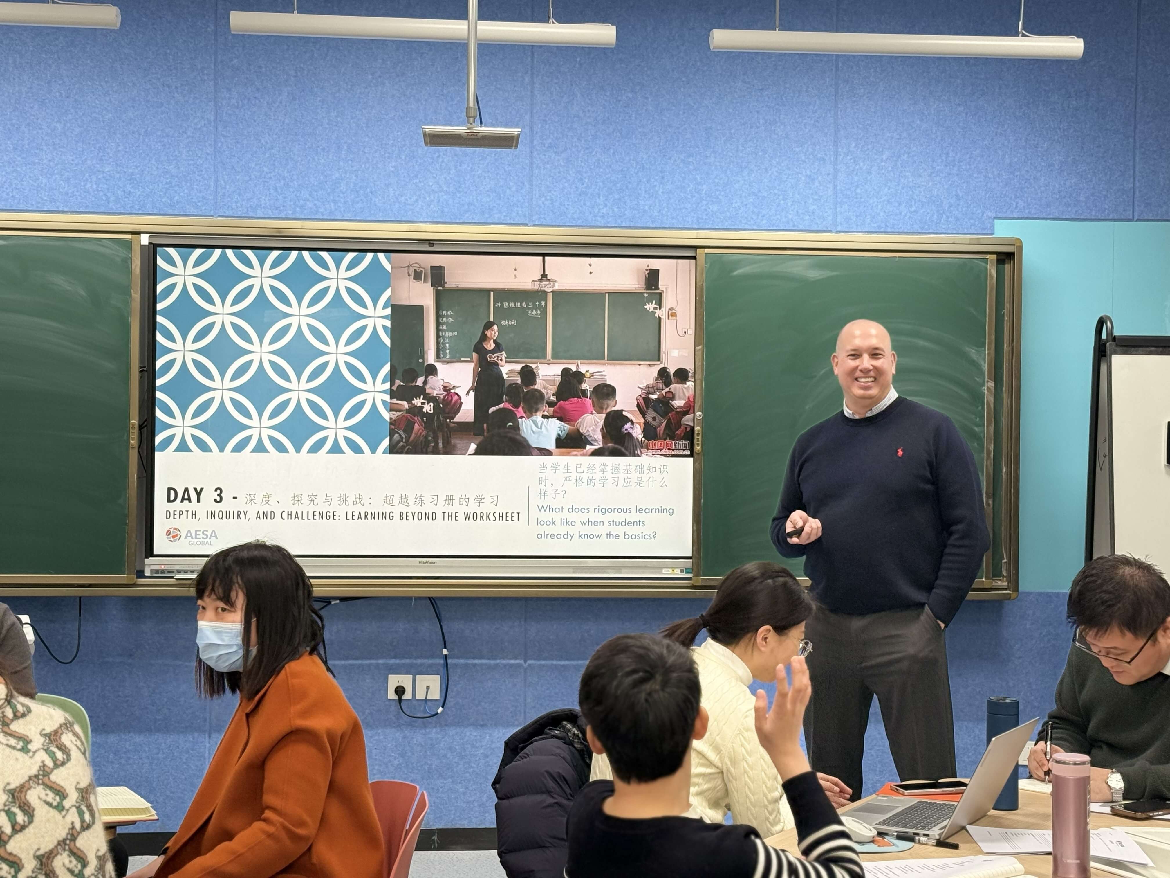 man teaching to classroom in China