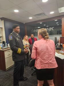 Police Chief Speaking with a woman